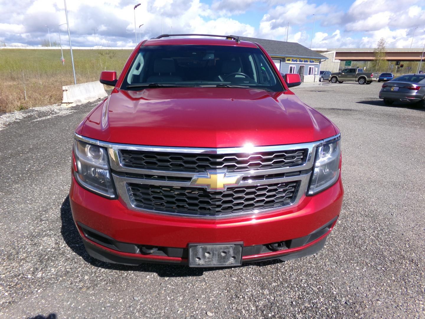 2015 Red Chevrolet Tahoe LT 4WD (1GNSKBKC8FR) with an 5.3L V8 OHV 16V engine, 6-Speed Automatic transmission, located at 2630 Philips Field Rd., Fairbanks, AK, 99709, (907) 458-0593, 64.848068, -147.780609 - Photo#1